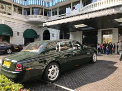 03B A green Rolls-Royce outside the entrance to The Peninsula Hotel Hong Kong